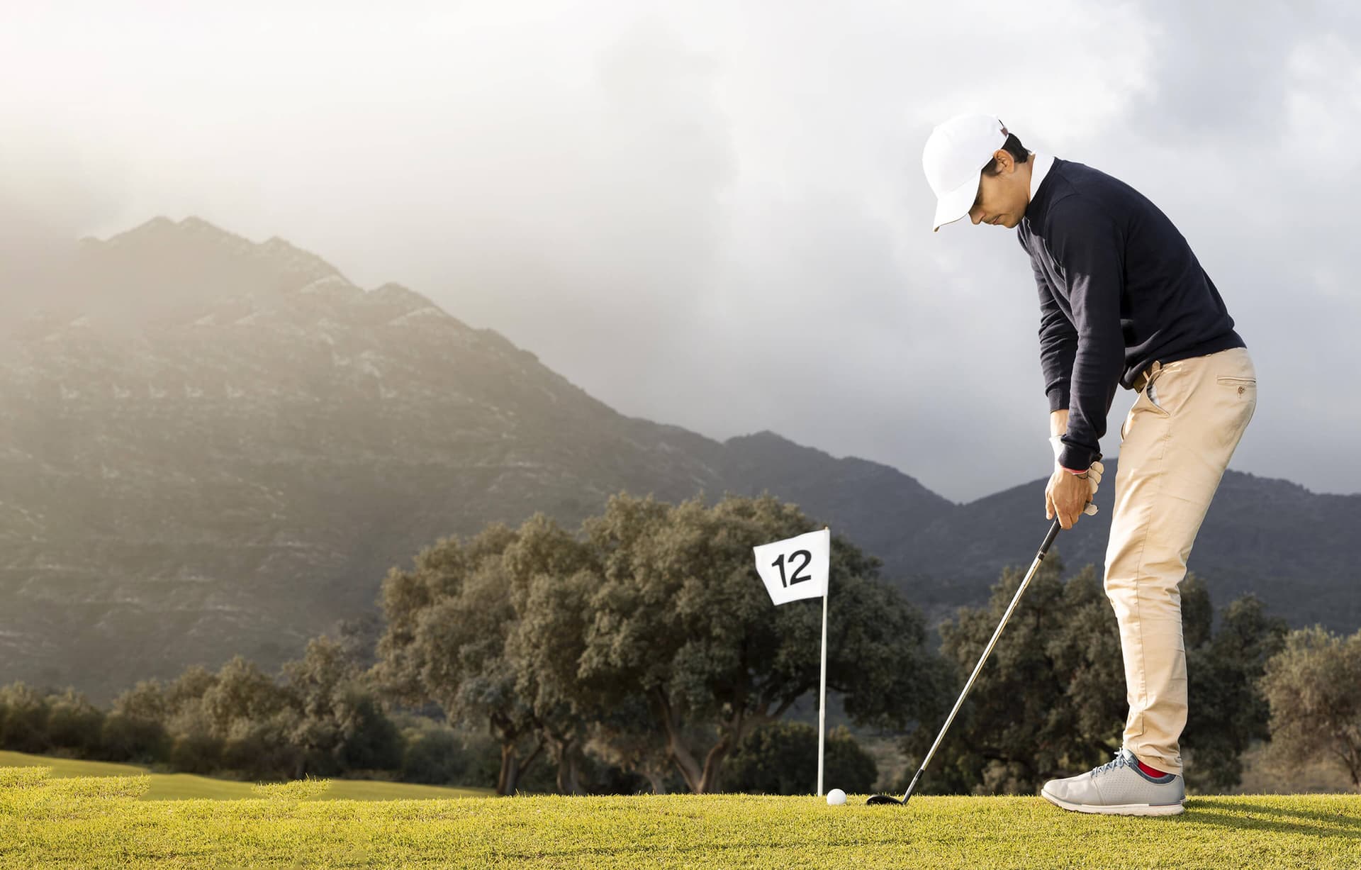 image of a golfer chippig onto the green